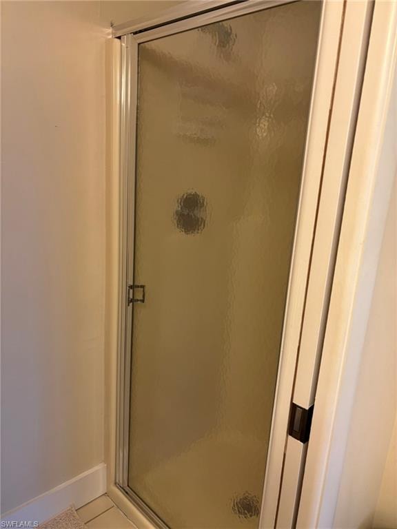 Master Bath features private commode and shower area with pocket door