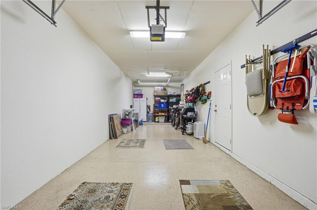 1.5 car garage with epoxy floor and plenty of storage