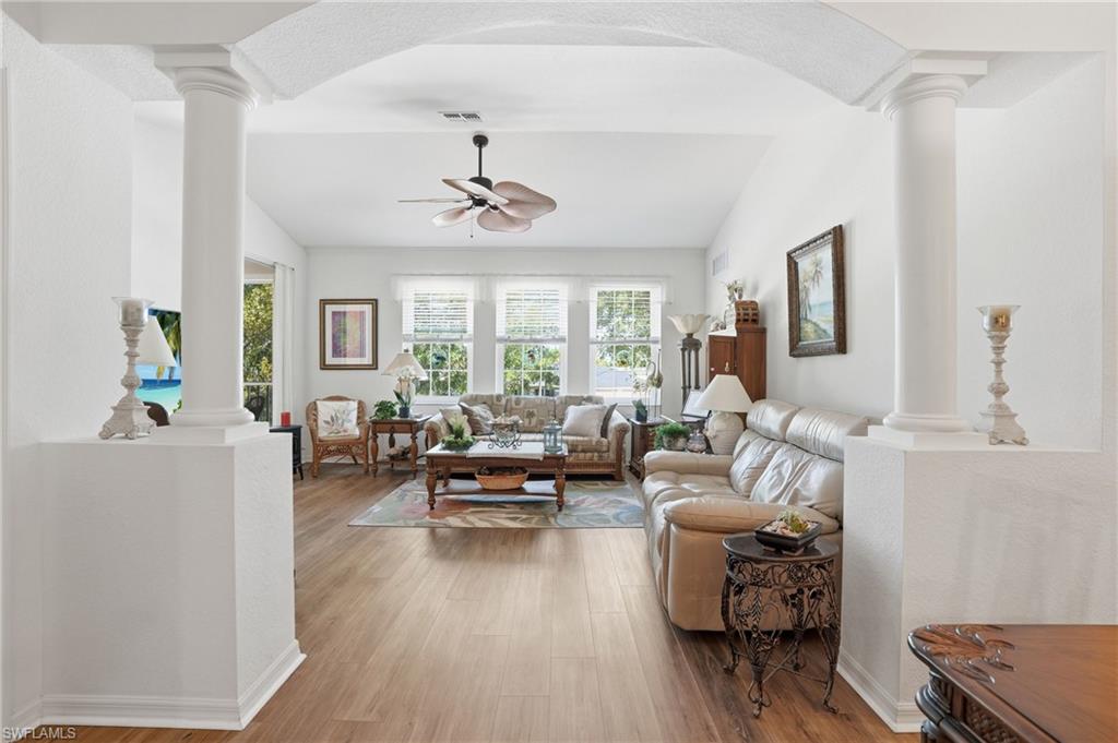 Entry to family room framed with archway and columns