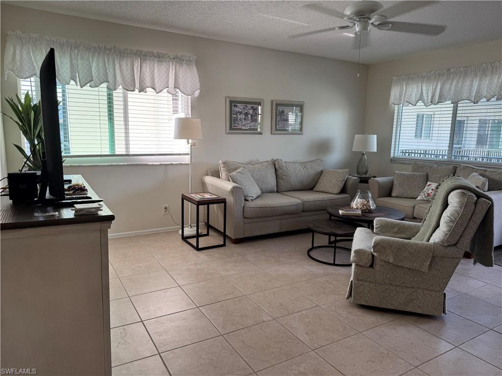 Living room featuring light tile floors
