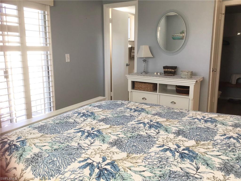 Primary bedroom with walk-in closet