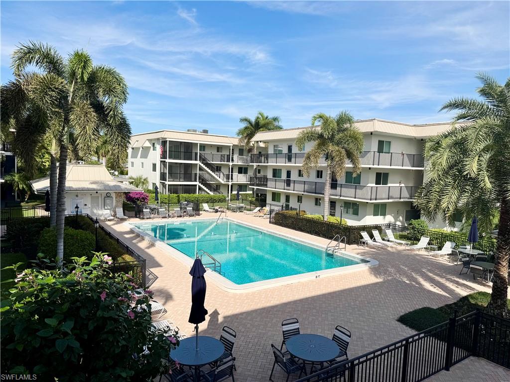 Community pool featuring a patio area