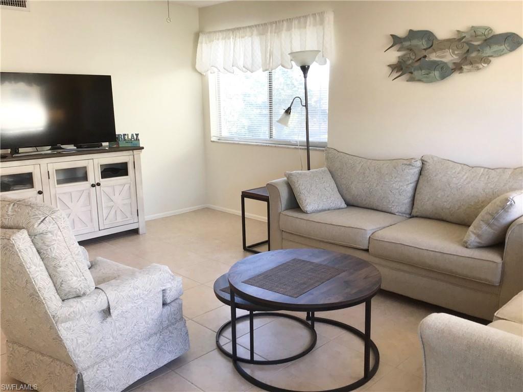 Living room area with large screen TV