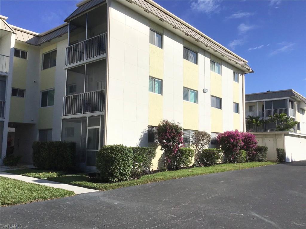 Backside of building with parking - space #312