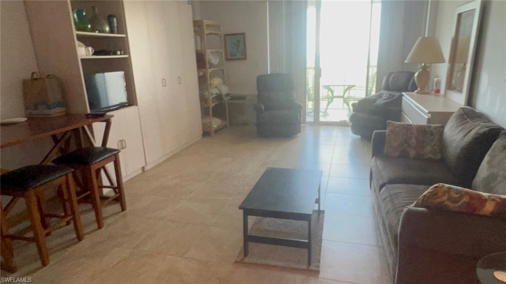 Living room featuring light tile patterned floors