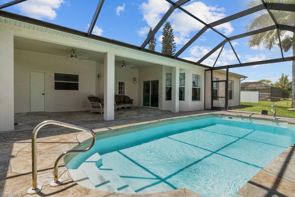 Screened outdoor pool with integrated steps and a stainless steel grab rail