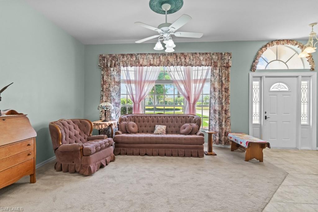Entryway featuring a decorative arched transom window above a panel door with sidelights