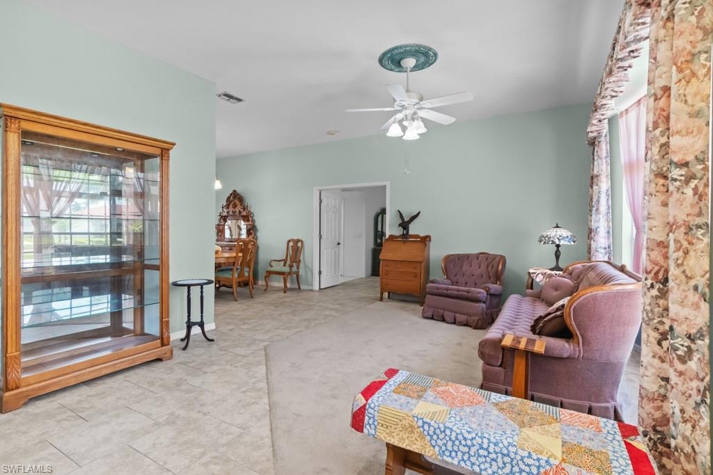 Spacious room with a ceiling fan, recessed lighting, and a large window