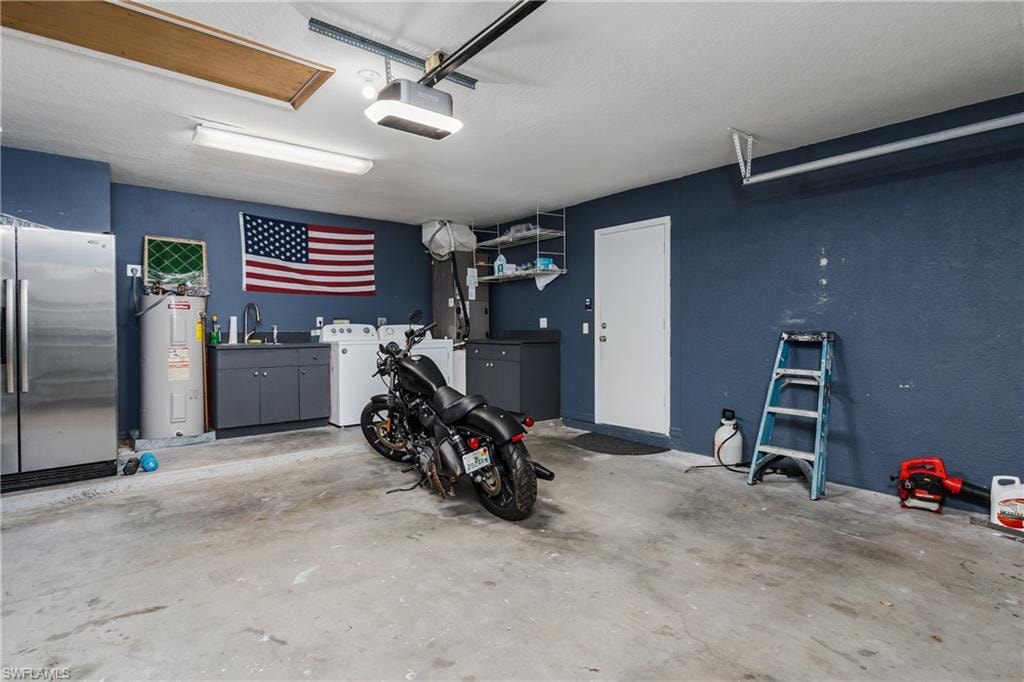 Spacious garage with concrete flooring and dark blue walls
