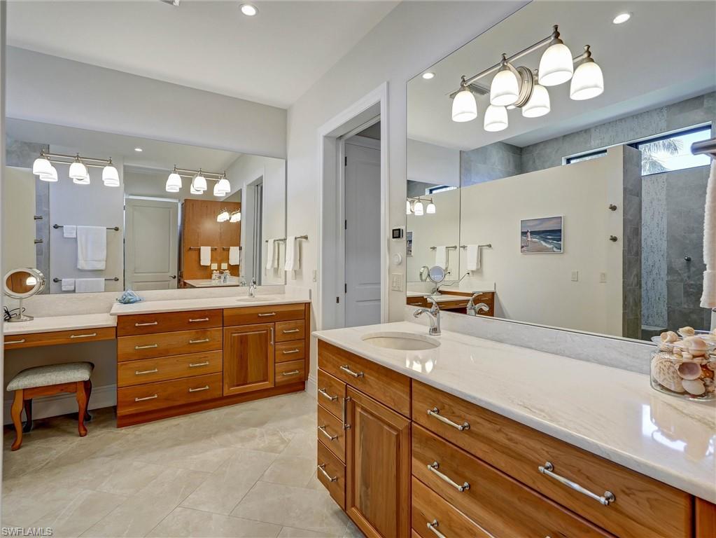 Elegant cabinetry & special lighting makes your bath a private delight