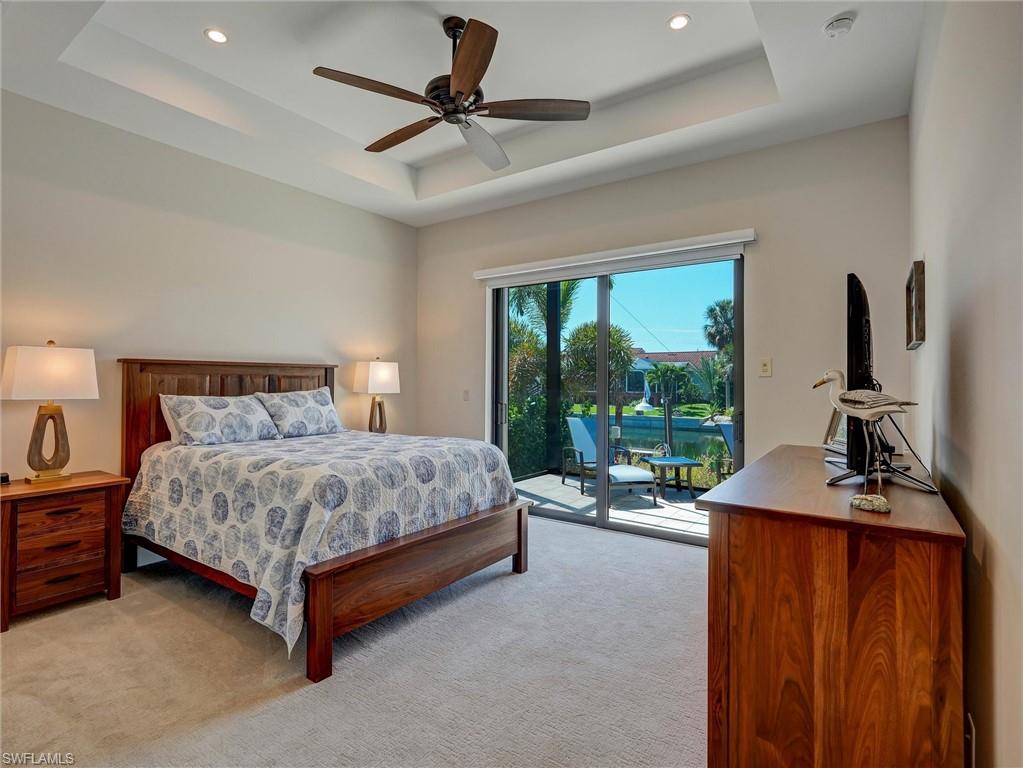 Secondary "En suite" bedroom flooded with sunshine & Hunter Douglas shades for an afternoon nap.