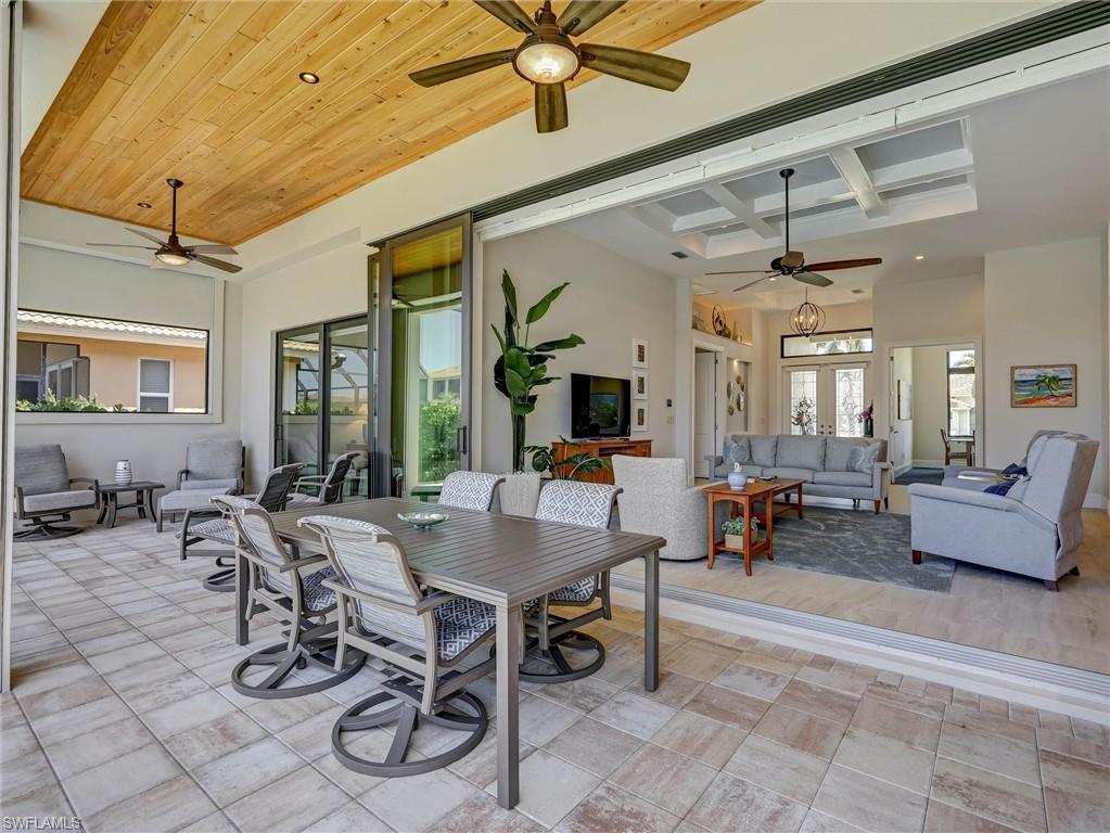 Enjoy visiting with guests on your lanai with easy access to the great room. Note the huge slider tucked away for convenience