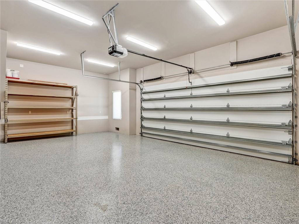 Wonderful, oversized garage with polyaspartic floor & A/C split unit for year round comfort
