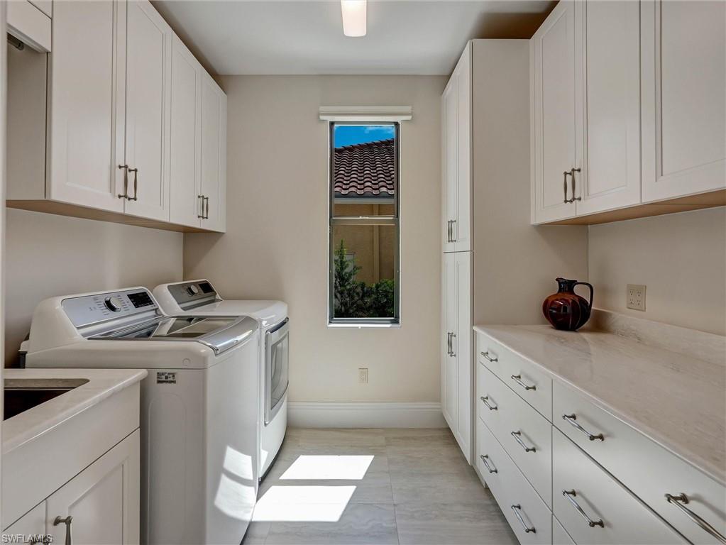 Sunny laundry room with lots of storage & work space