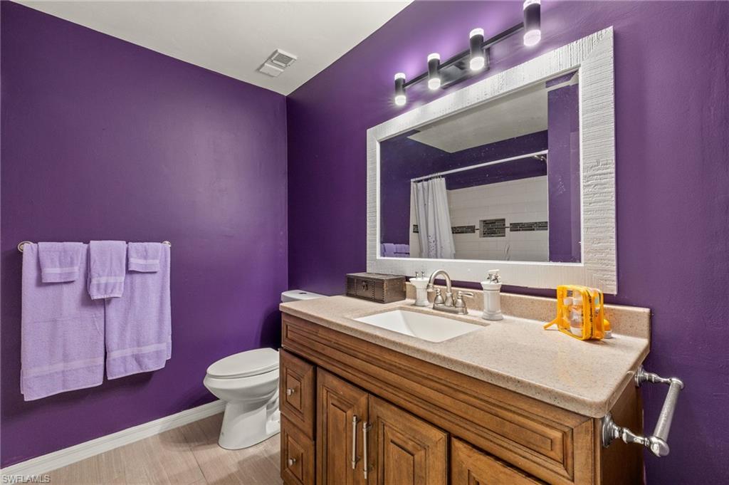 Bathroom with vanity and curtained shower