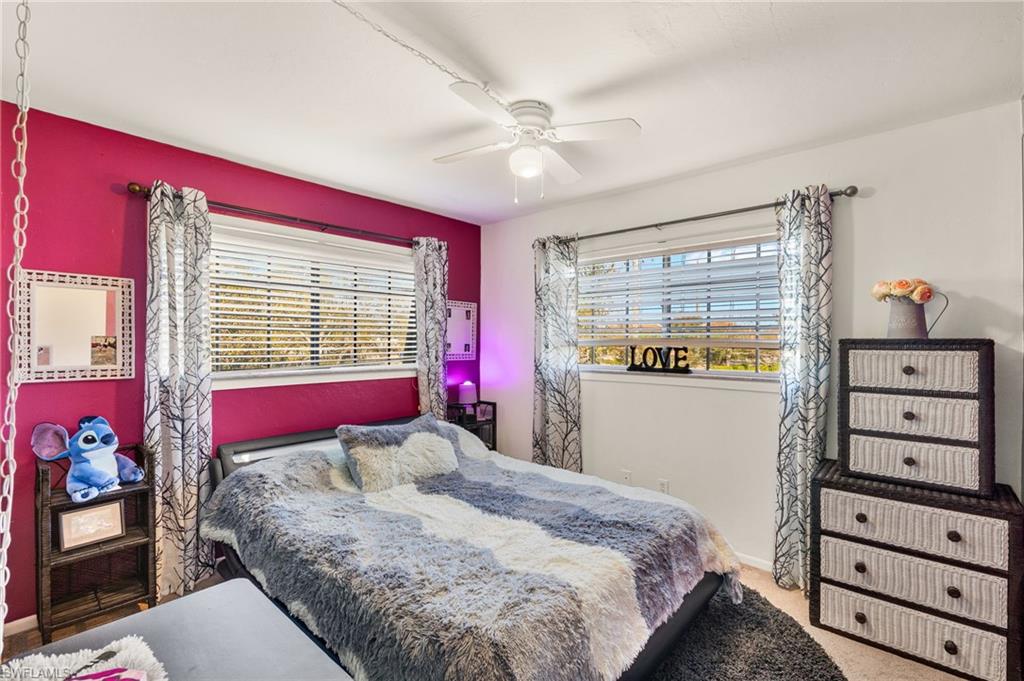 Bedroom featuring carpet flooring and a ceiling fan