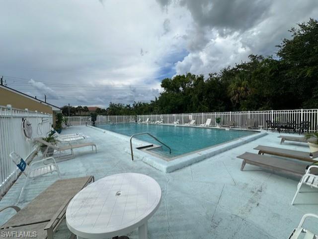 Community pool featuring a patio area