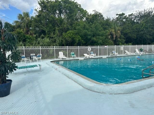 Community pool with a patio area