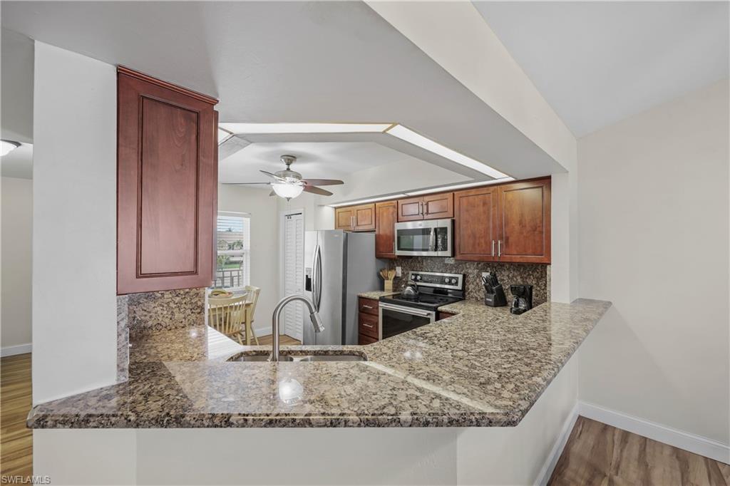 Updated kitchen with granite counter and stainless appliances