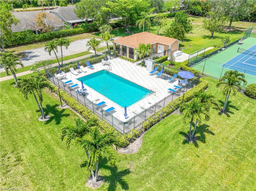 Pool with bathrooms and tennis / pickleball court a short walk away