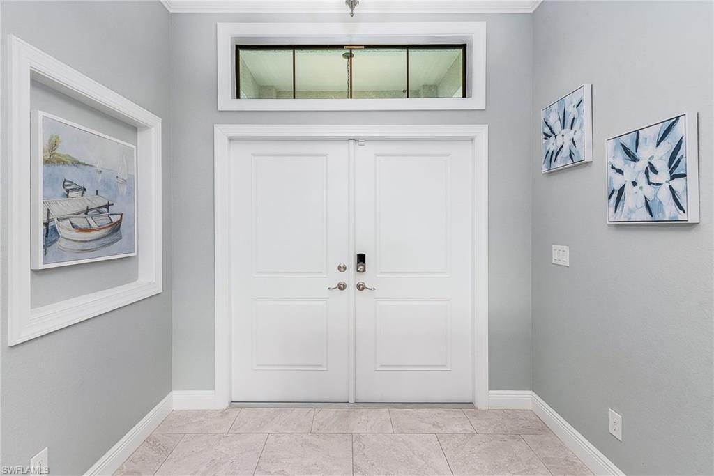 Foyer entrance featuring baseboards