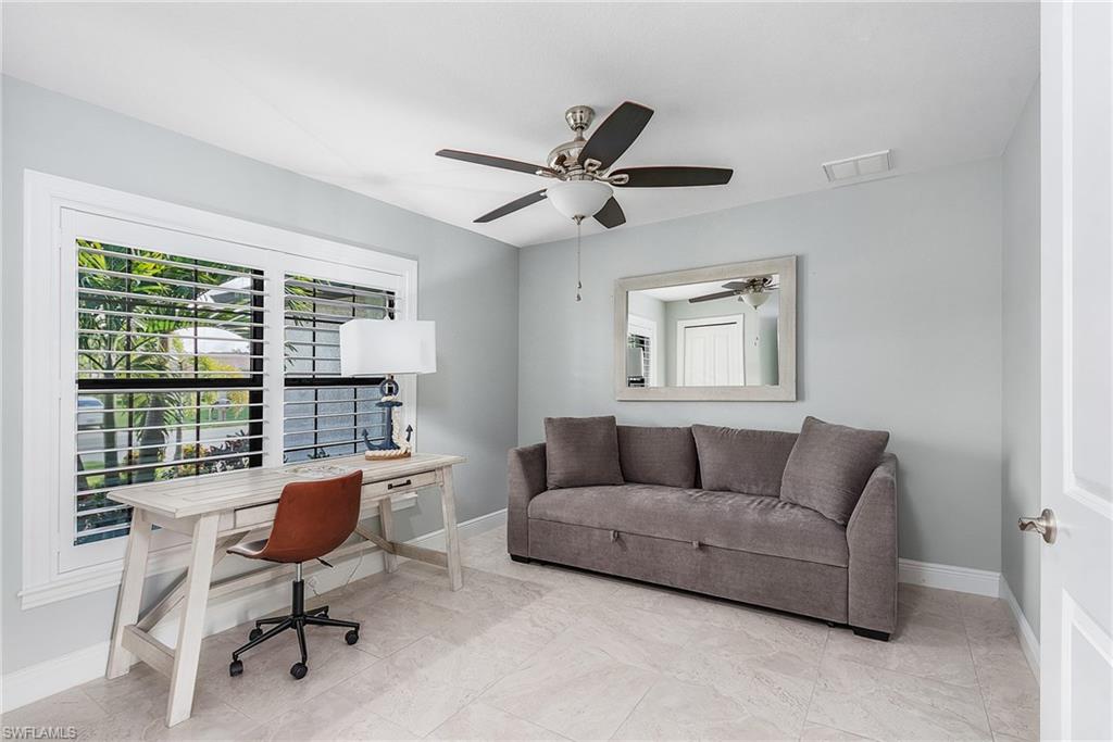 Home office featuring baseboards, visible vents, and ceiling fan