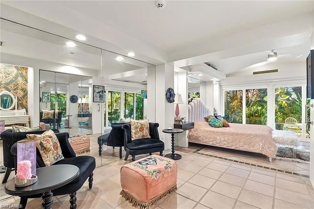 Bedroom featuring light tile patterned flooring, access to outside, multiple windows, and recessed lighting