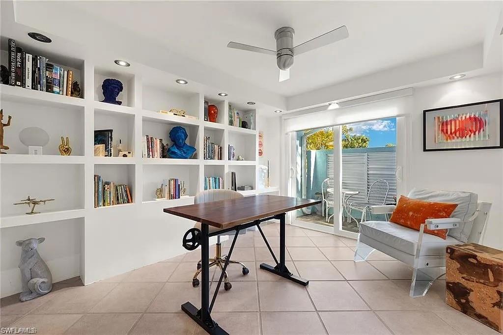 Office space with a ceiling fan, light tile patterned floors, built in features, and recessed lighting