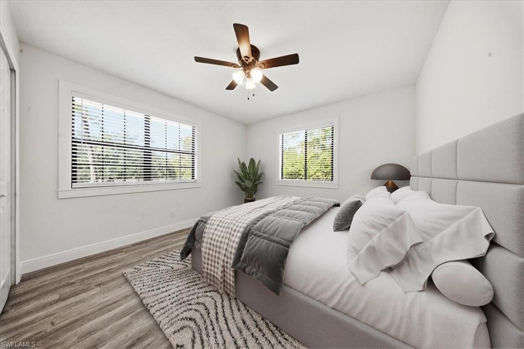 Bedroom with light wood finished floors and a ceiling fan