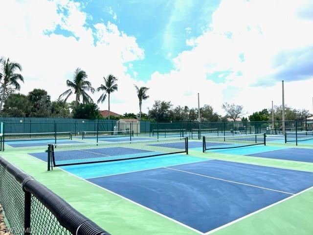 View of sport court featuring fence