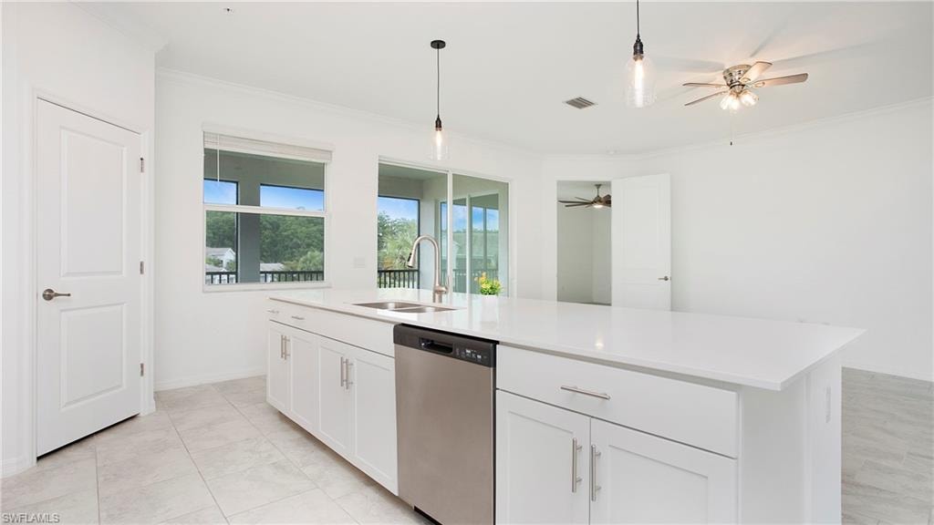Modern kitchen island with integrated sink and stainless steel dishwasher