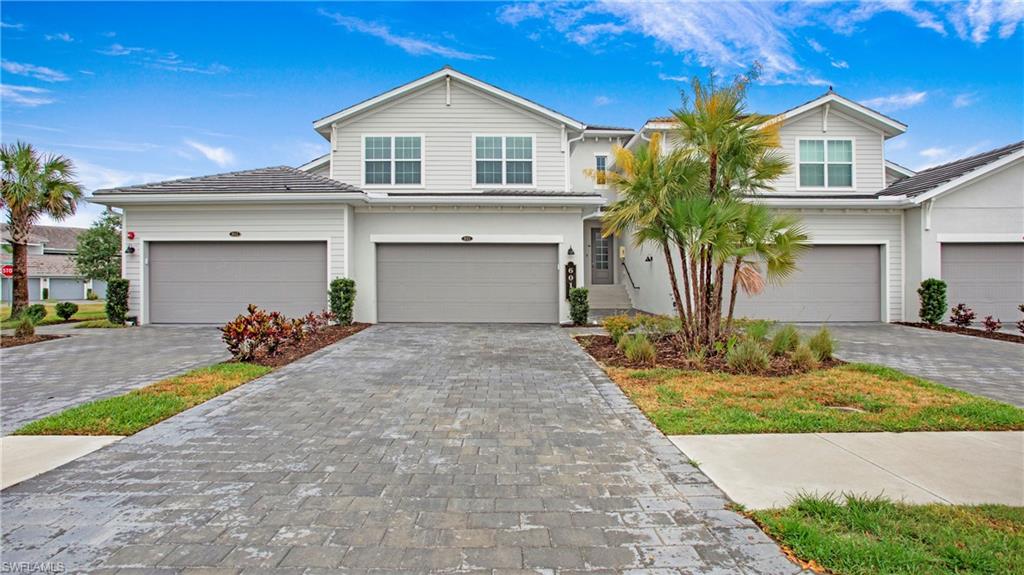 View of front of home featuring decorative driveway