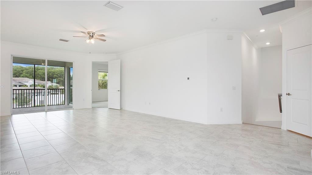 Expansive interior space featuring large format tile flooring and a screened balcony