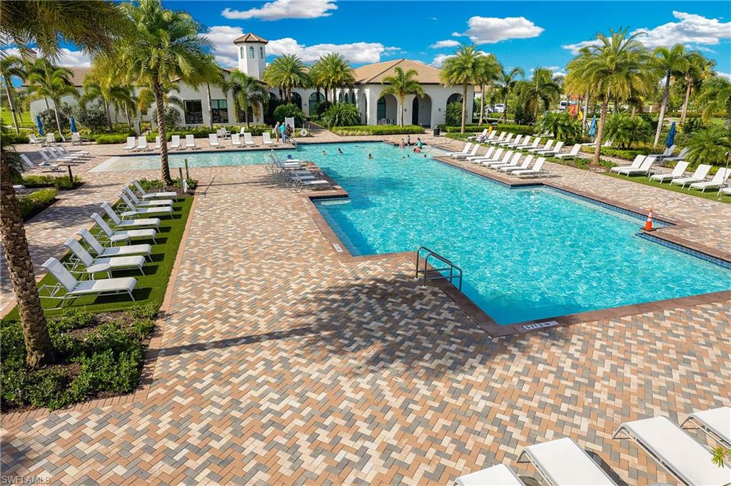Expansive community pool with ample lounge seating