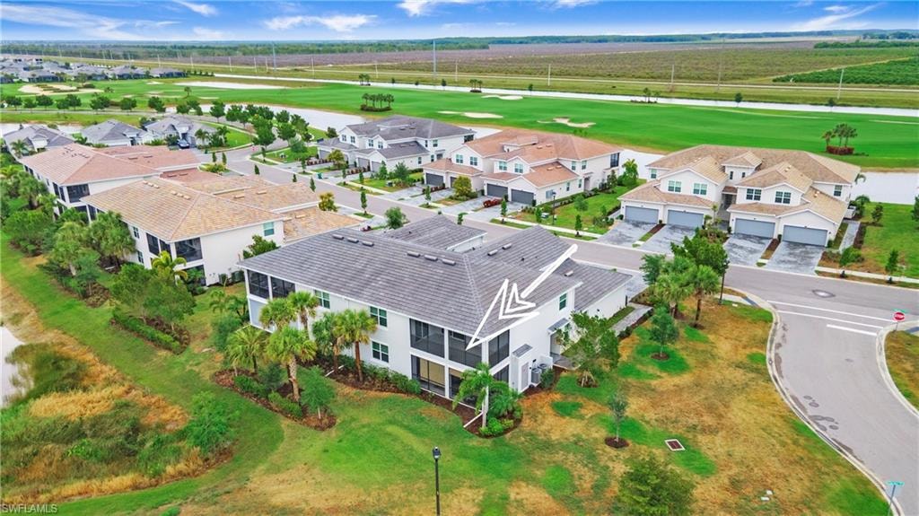 Two-story residence with a gray tile roof and white exterior siding