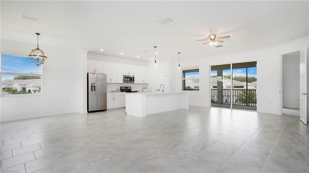 Open-concept living space with light-toned tiled flooring