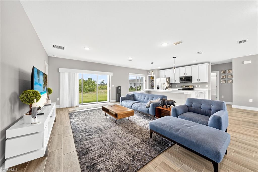 Living room with wood finish floors and recessed lighting