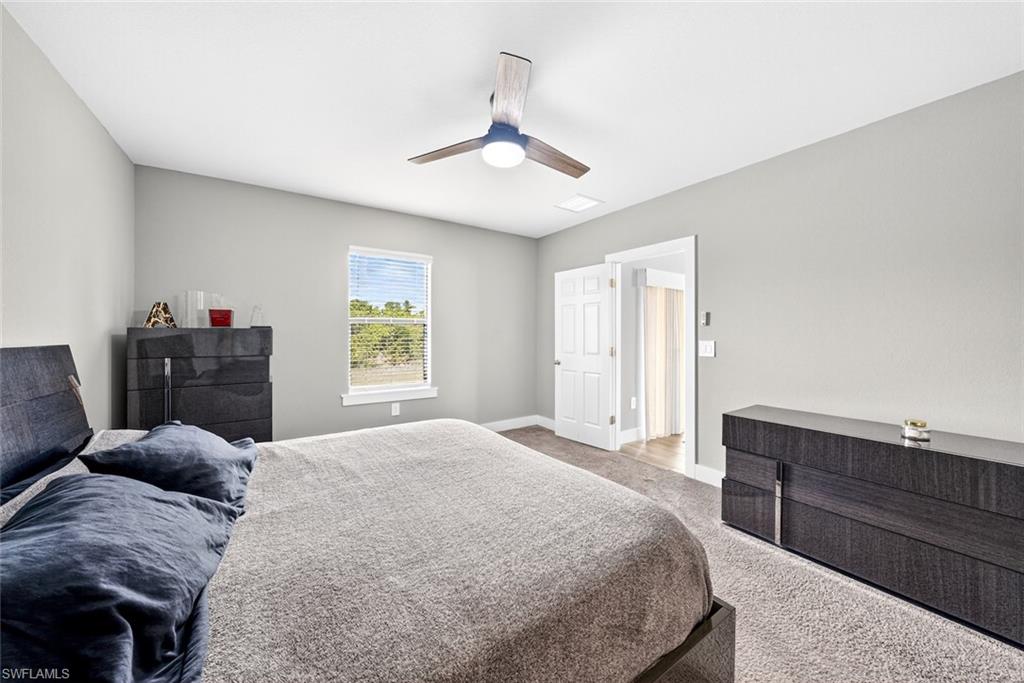 Bedroom with carpet floors and a ceiling fan