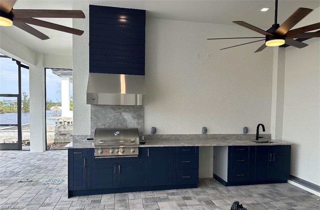 View of swimming pool with a patio area, ceiling fan, and a lanai