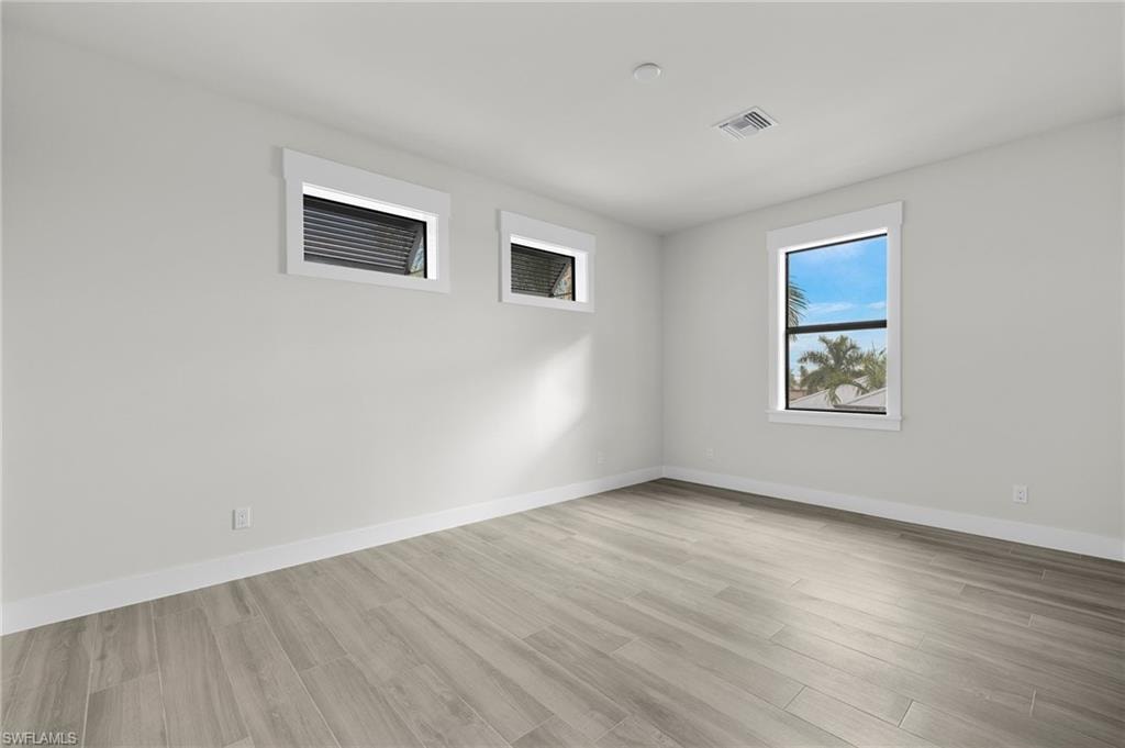 Spare room featuring light hardwood / wood-style floors