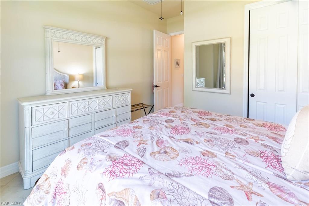 Bedroom featuring a closet and tile patterned flooring