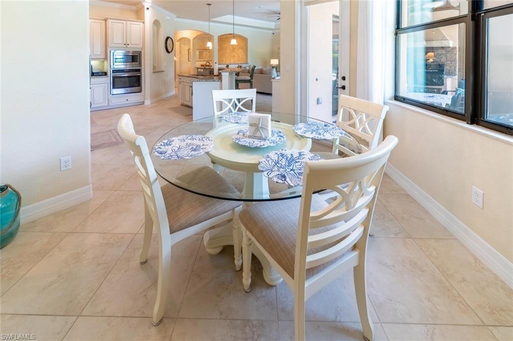 Tiled dining room with crown molding