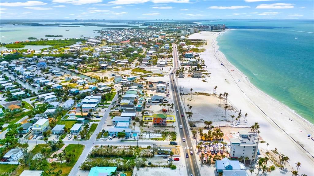 Birds eye view of property featuring a water view and a beach view - VIRTUALLY EDITED EXTERIOR IMAGE
