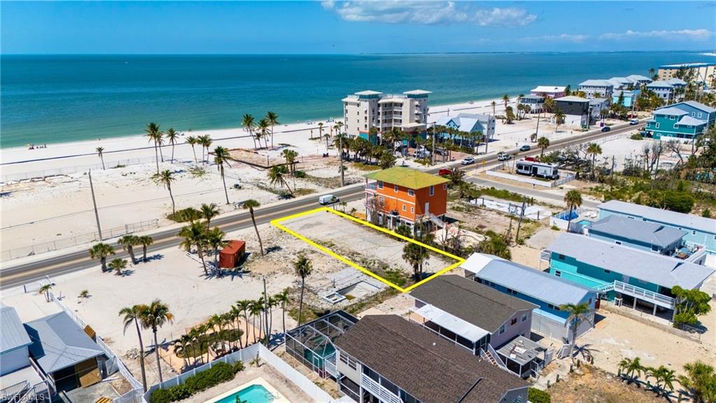 Bird's eye view with a beach view and a water view - VIRTUALLY EDITED EXTERIOR IMAGE