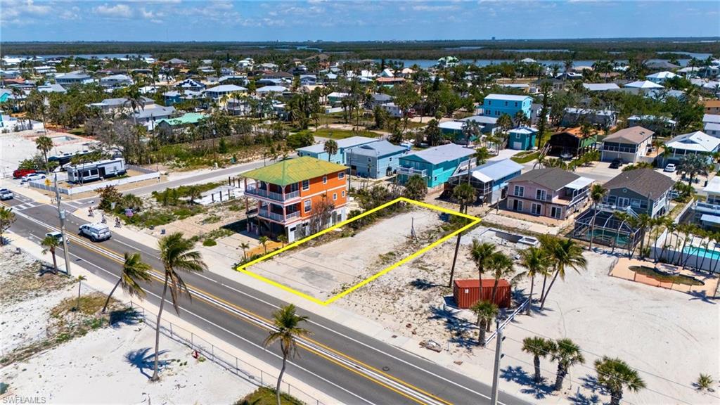 Birds eye view of property with a water view and a residential view - VIRTUALLY EDITED EXTERIOR IMAGE