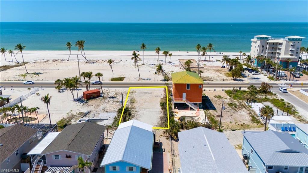 Aerial view featuring a water view and a view of the beach- VIRTUALLY EDITED EXTERIOR IMAGE