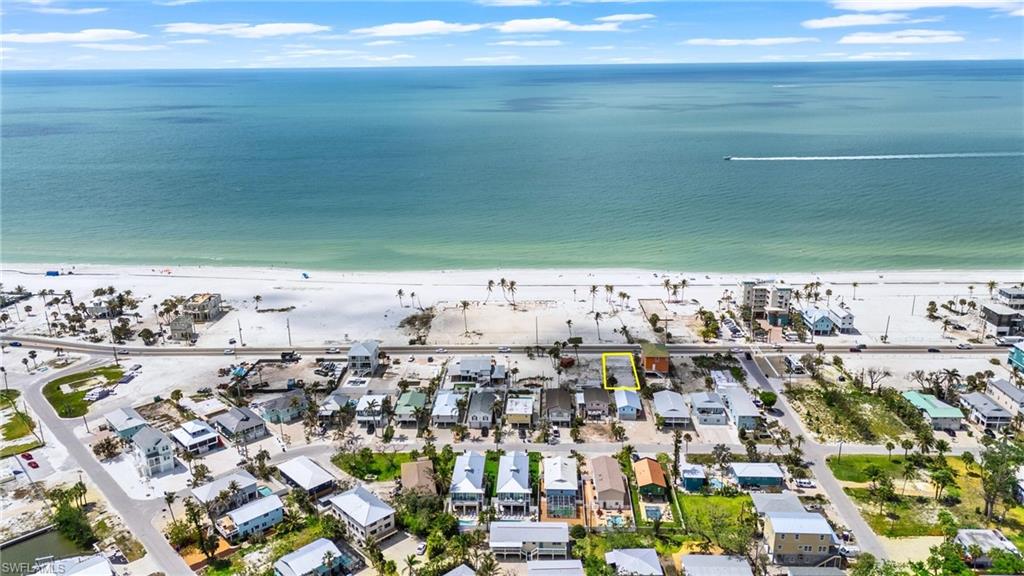 Birds eye view of property featuring a water view and a beach view - VIRTUALLY EDITED EXTERIOR IMAGE