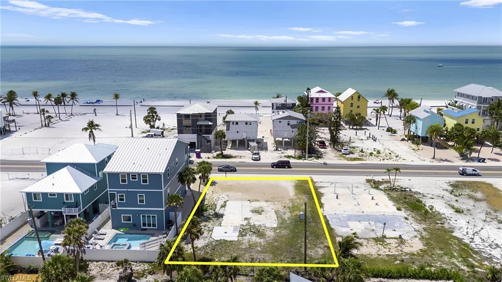 Sunsets Galore Birds eye view of property with a water view and a residential view  - Virtually Edited Image