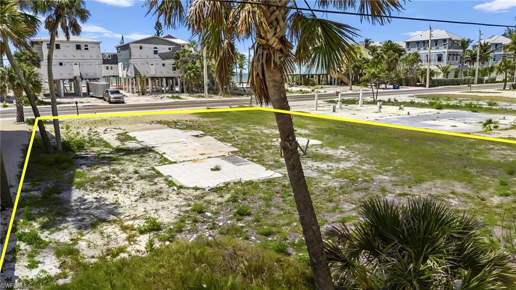 Surrounding community featuring a residential view and a yard  - Virtually Edited Image