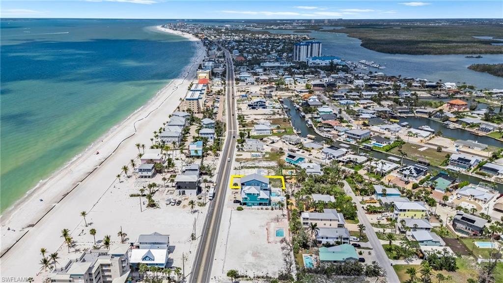 Aerial view with a view of the beach, a residential view, and a water view  - Virtually Edited Image
